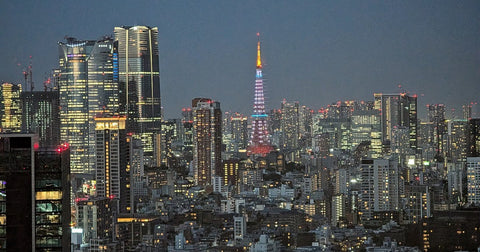 Tokyo skyline at dusk with Tokyo Tower lit up, seen from Shibuya
